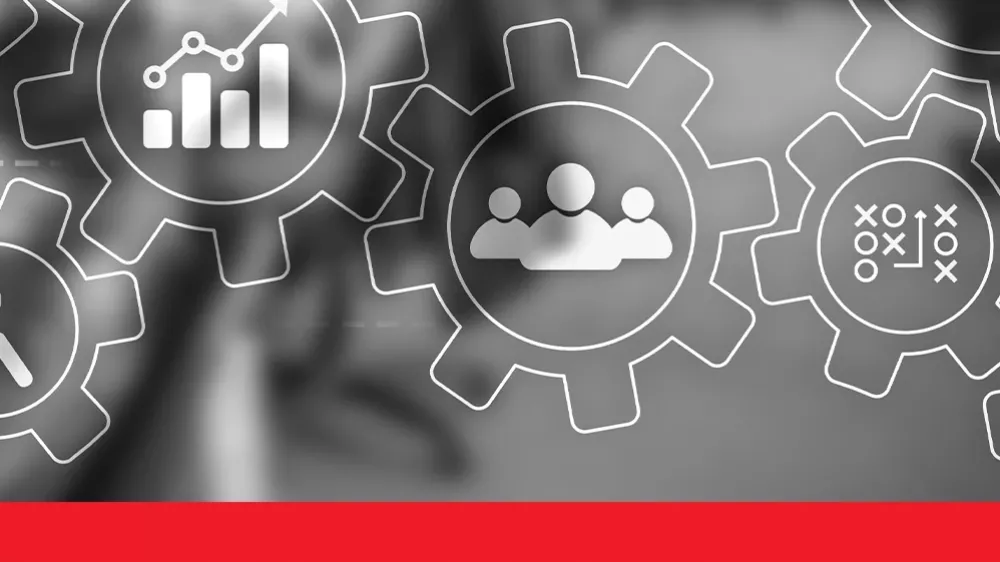 Transparent gear icons with business symbols over a blurred office background.