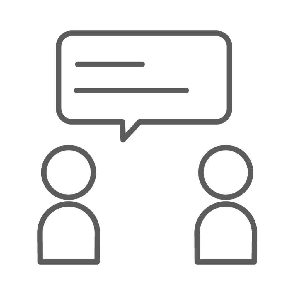 Icon showing two people facing each other with a speech bubble, symbolizing dialogue or conversation.